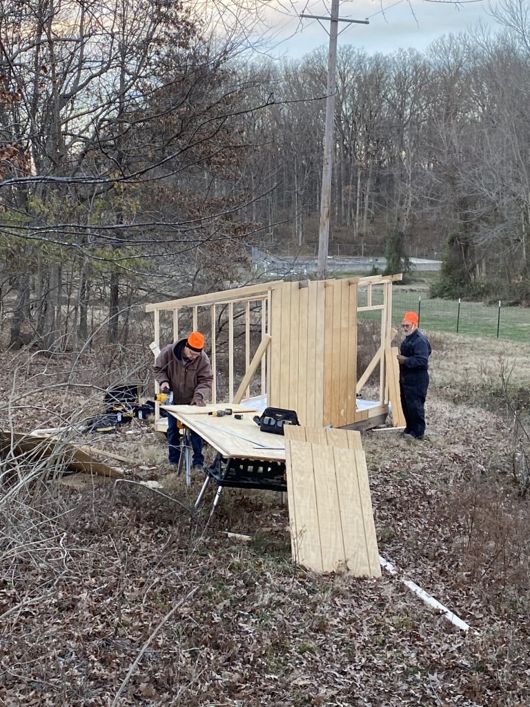 Volunteers building our goats a nice winter shed! These two men have helped with so many projects and we are great friends of LS! Thanks guys!