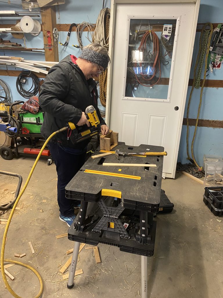A local volunteer helping us make some gifts for local pastors! Thank you for serving!