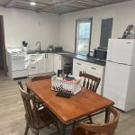 Kitchen stocked with cooking and dining ware