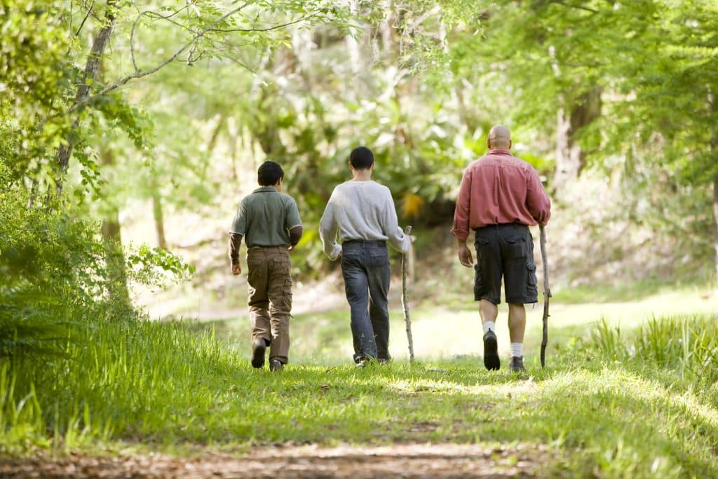 Father and sons hiking